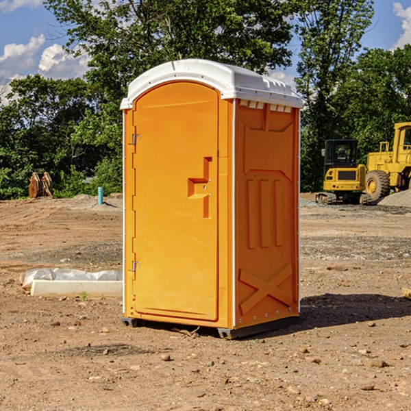 what is the cost difference between standard and deluxe portable restroom rentals in Blakeslee